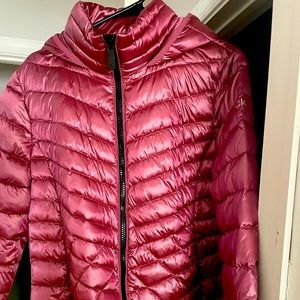 Pink Calvin Klein packable down coat.